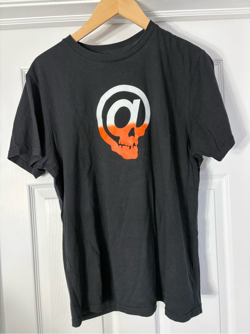 Black Short-Sleeve Graphic Tee with White-and-Orange Skull Motif